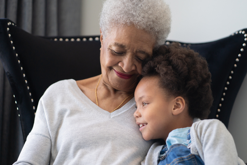happy-grandmother-holding-granddaughter