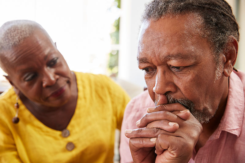 senior lady cocerned with senior man
